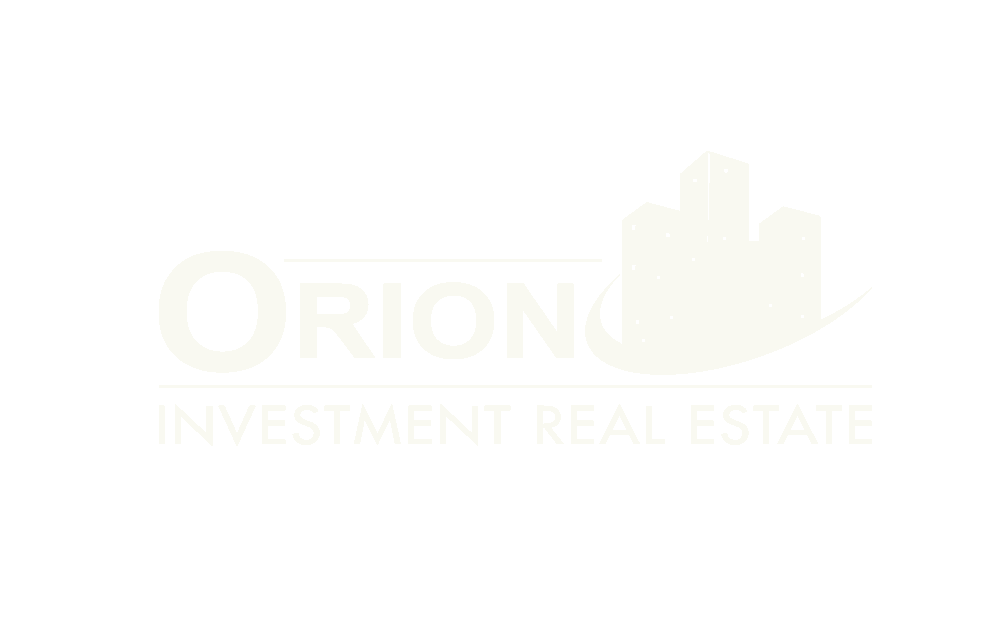 Faint logo with the text "Orion Investment Real Estate" next to a stylized outline of buildings, reflecting expertise in commercial construction Arizona.